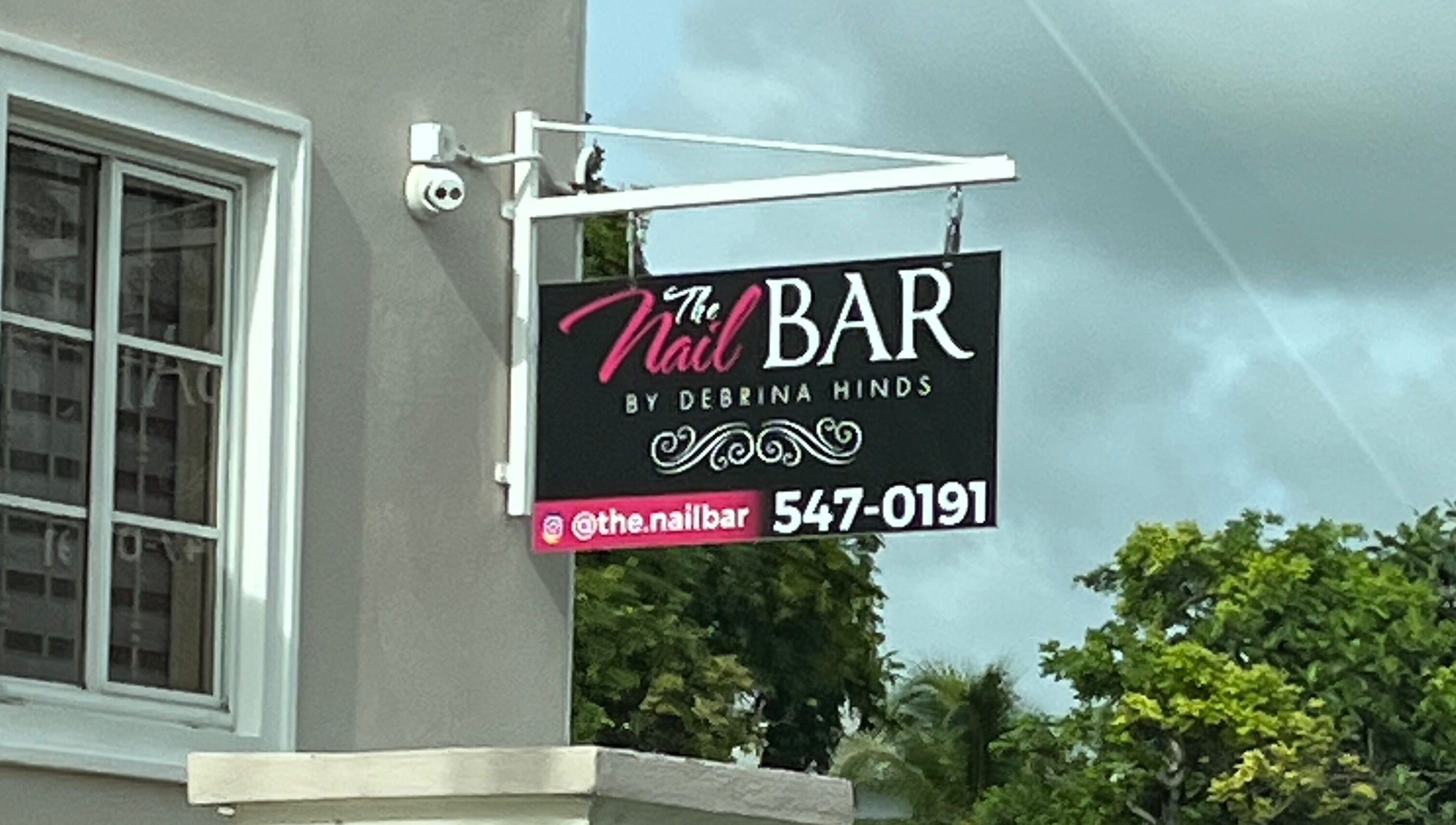 Chic sign for The Nail Bar offers a glimpse into Bellisima Touch & Spa's allure in Bridgetown, Saint Michael, BB.