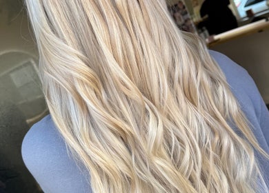 Beautiful blonde hair waves styled at Bonito Hair and Beauty, Rushden, England, GB.