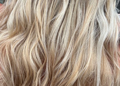 Blonde wavy hair styled at Bonito Hair and Beauty in Rushden, England, GB.