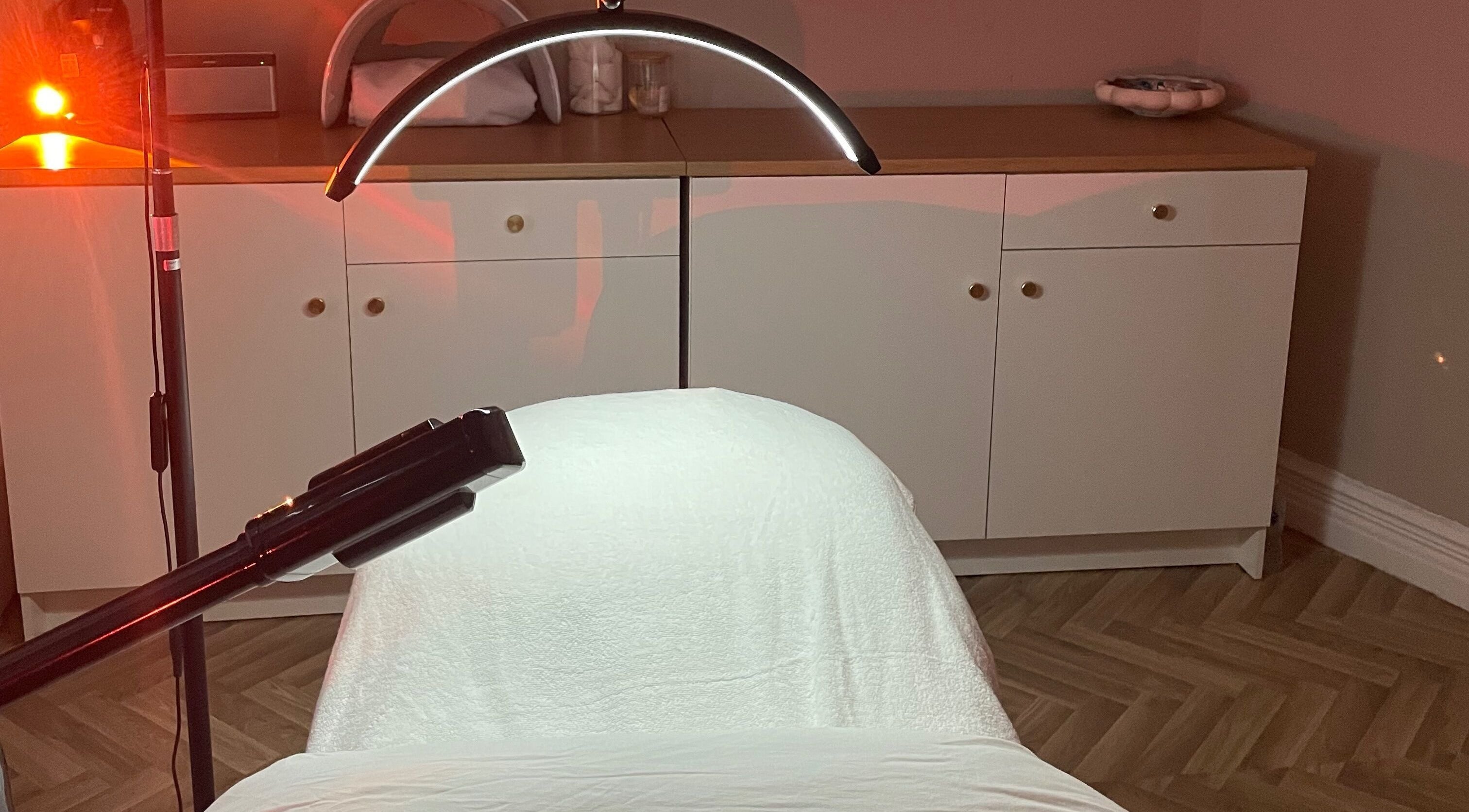 LED treatment area at Skin Deep, Worsley, England, GB with ambient lighting and sleek equipment.