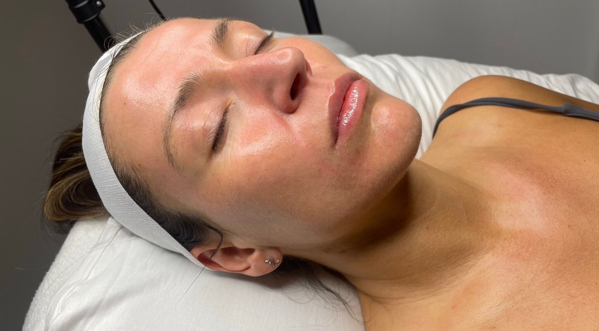 Relaxed client enjoying facial treatment at Skin Deep, Worsley, England, GB for radiant, healthy skin.