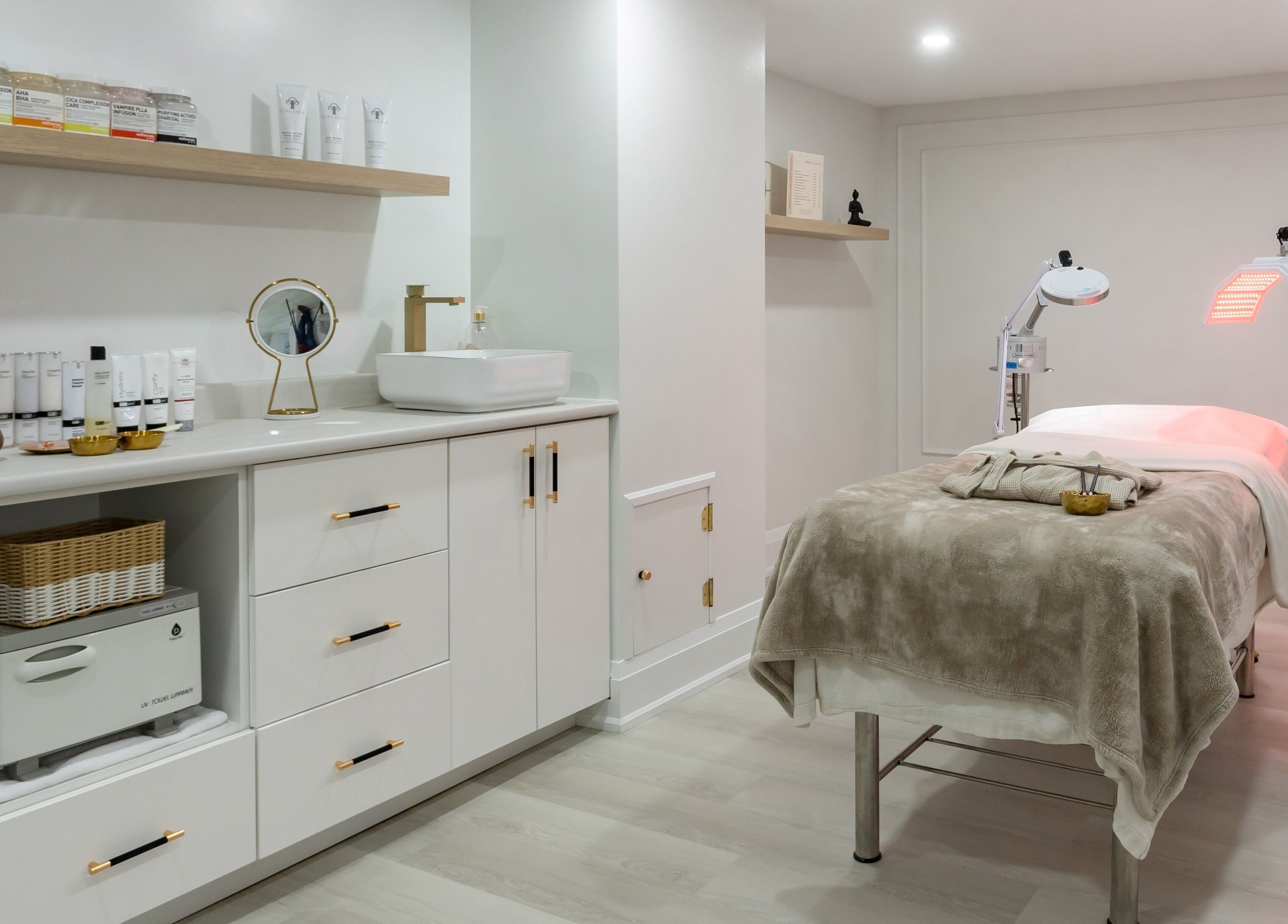 Serene treatment room at Aura Wellness, Vaughan, Ontario, CA, showcasing modern decor and relaxing ambiance.