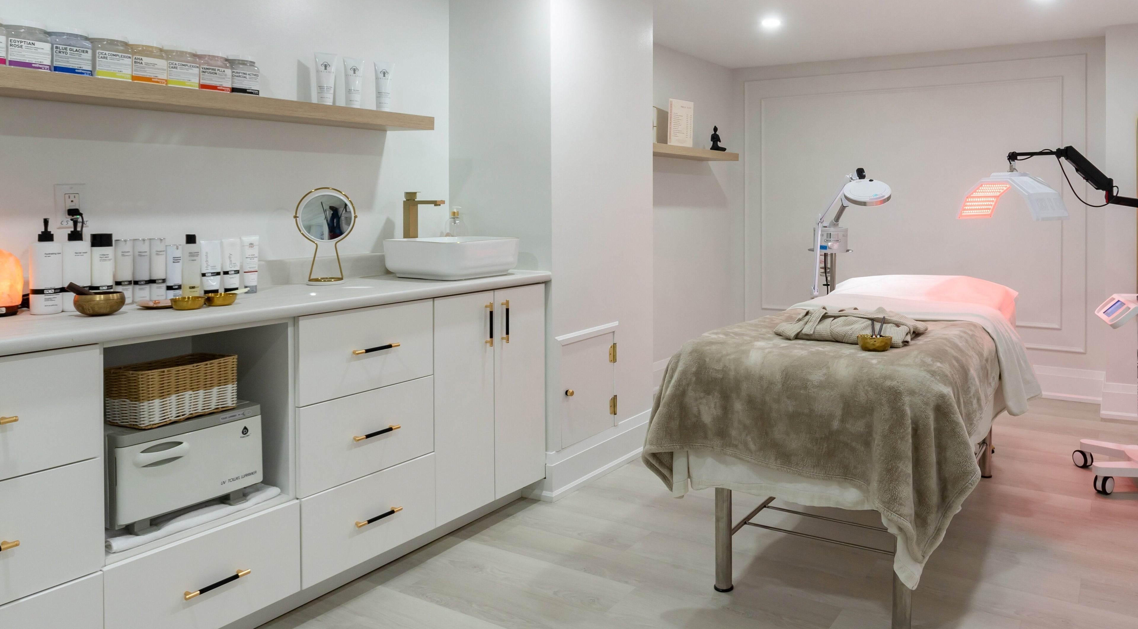 Serene treatment room at Aura Wellness, Vaughan, Ontario, CA, showcasing modern decor and relaxing ambiance.