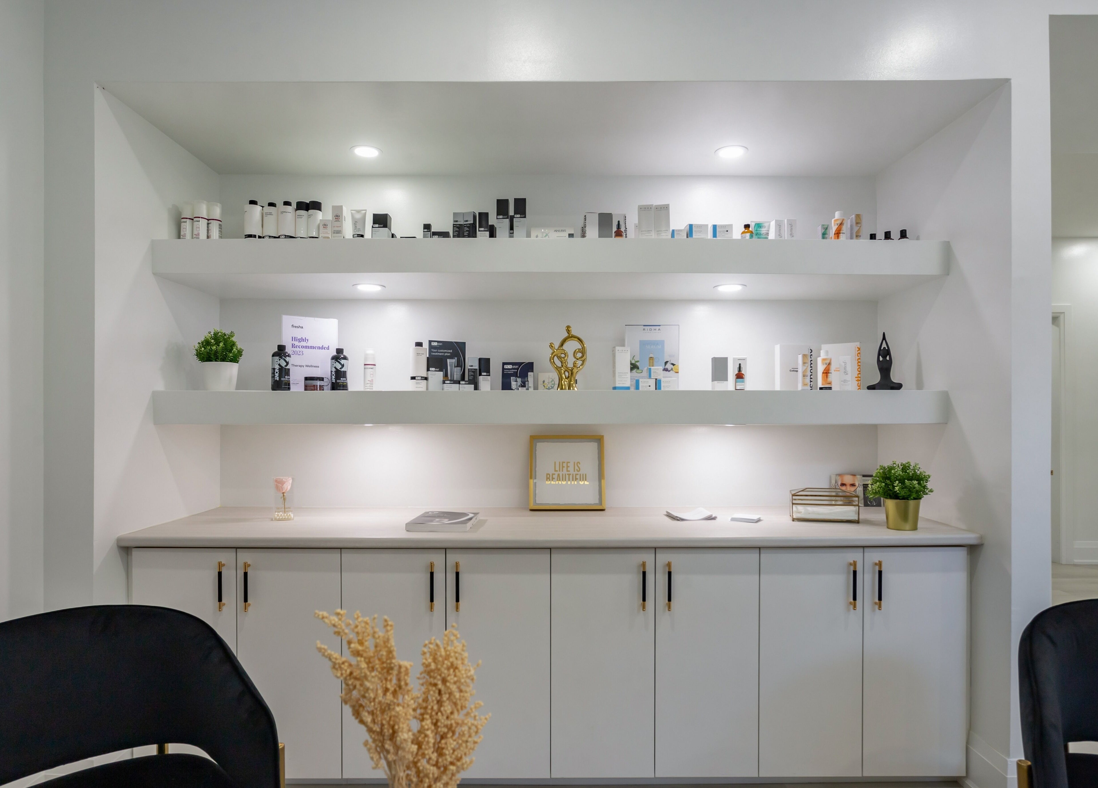 Chic display of beauty products at Aura Wellness in Vaughan, Ontario, CA, showcasing sleek interior design.