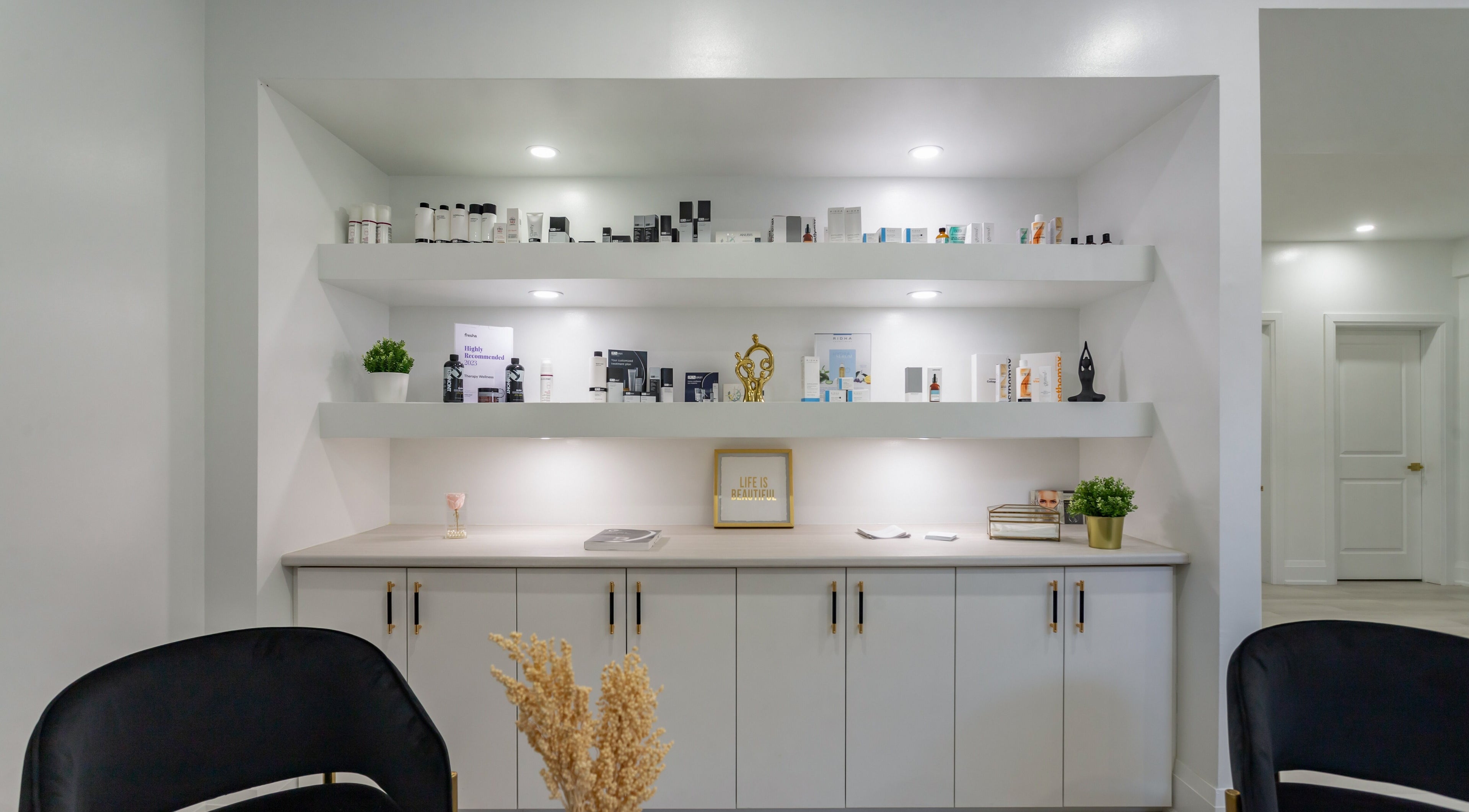 Chic display of beauty products at Aura Wellness in Vaughan, Ontario, CA, showcasing sleek interior design.