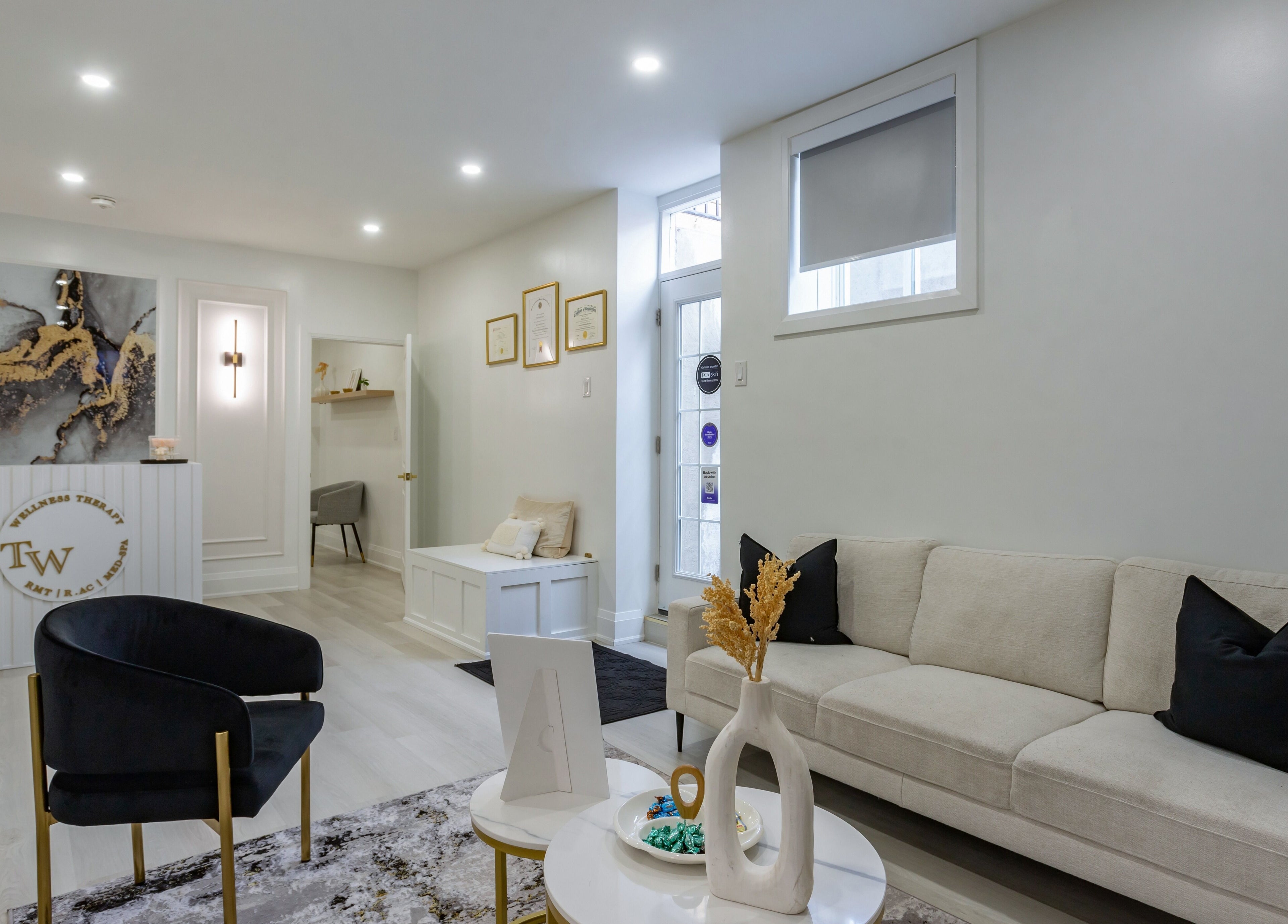 Stylish lounge at Aura Wellness, Vaughan, Ontario, CA, with plush seating and modern decor.