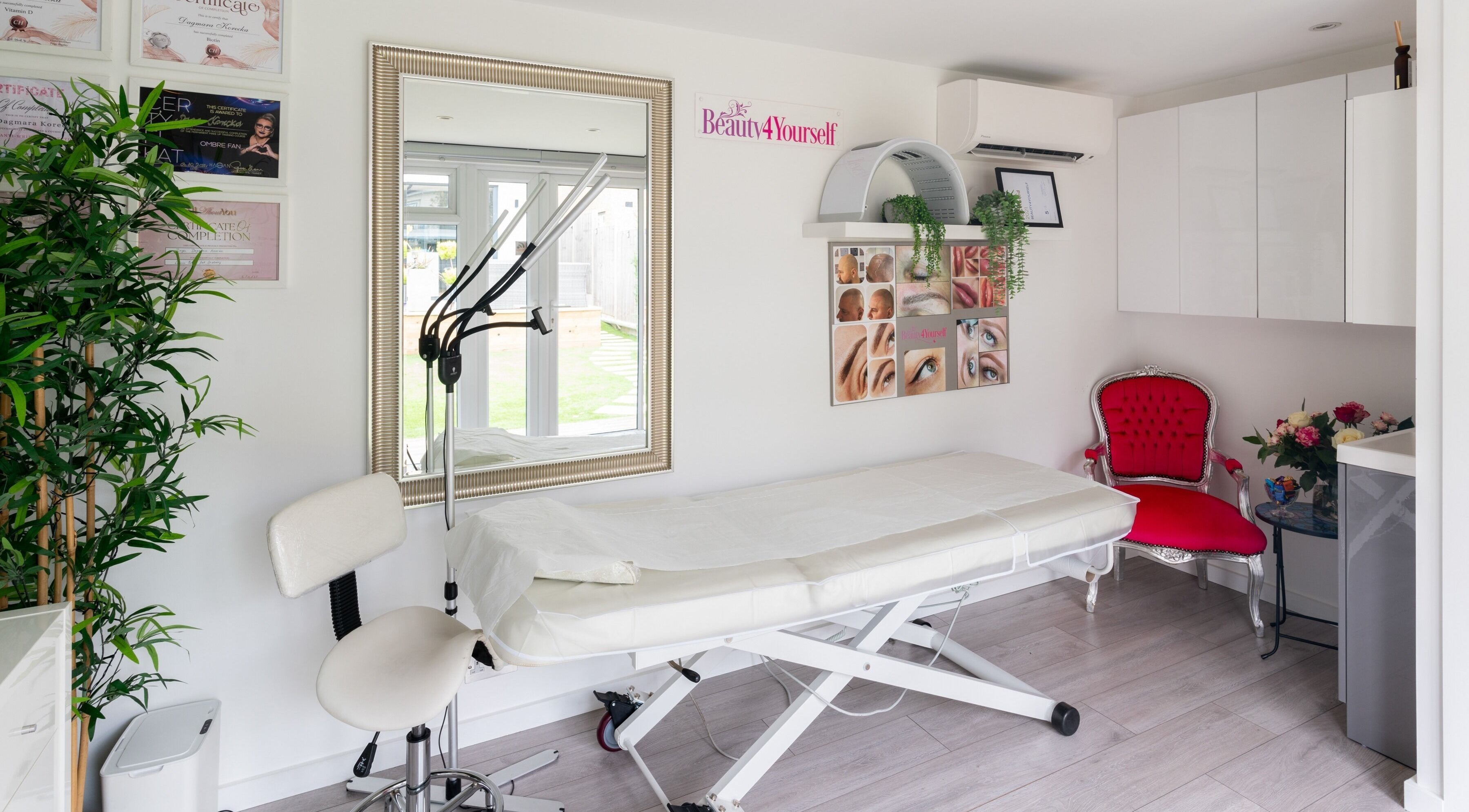 Serene treatment room at Beauty4Yourself, Surbiton, England, GB, featuring a luxury chair and greenery.