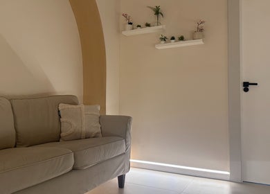Elegant lounge area at SKiN At The Collective, Gibraltar, GI with a comfy sofa and stylish decor.
