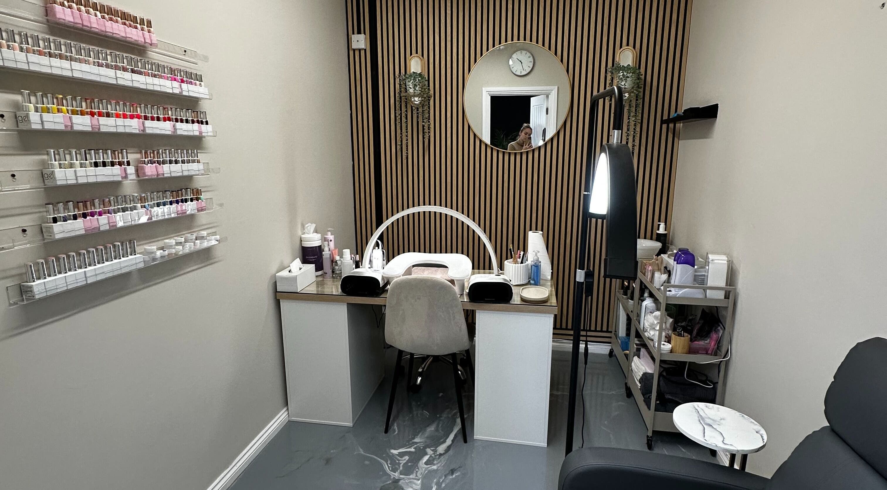 Modern nail service area at Polished By Sam, Bracknell, England, GB with elegant decor and polishes displayed.