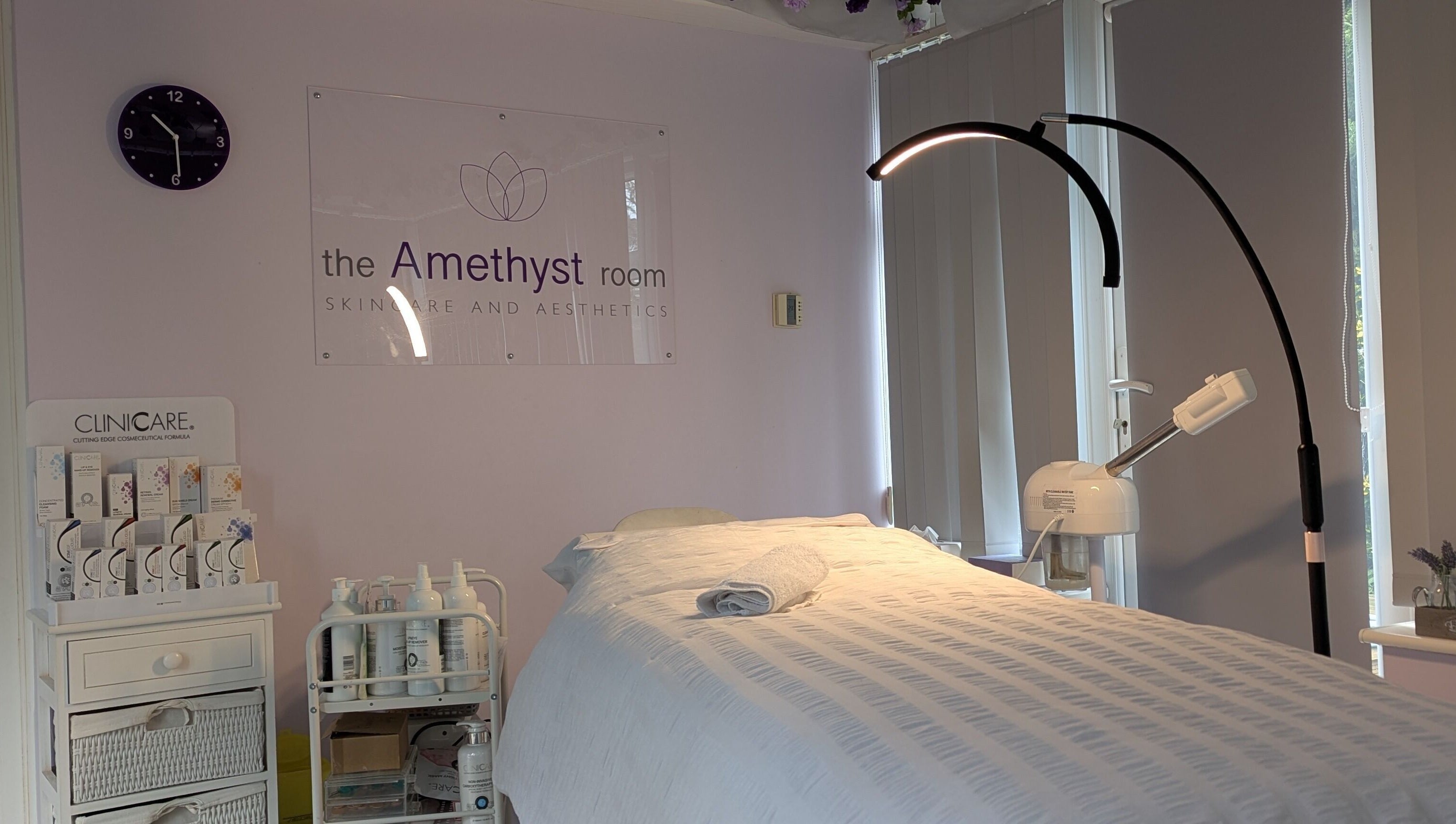 Relaxing treatment room at The Amethyst Room Rayleigh, featuring a cozy bed and aesthetic equipment in Rayleigh, England, GB.