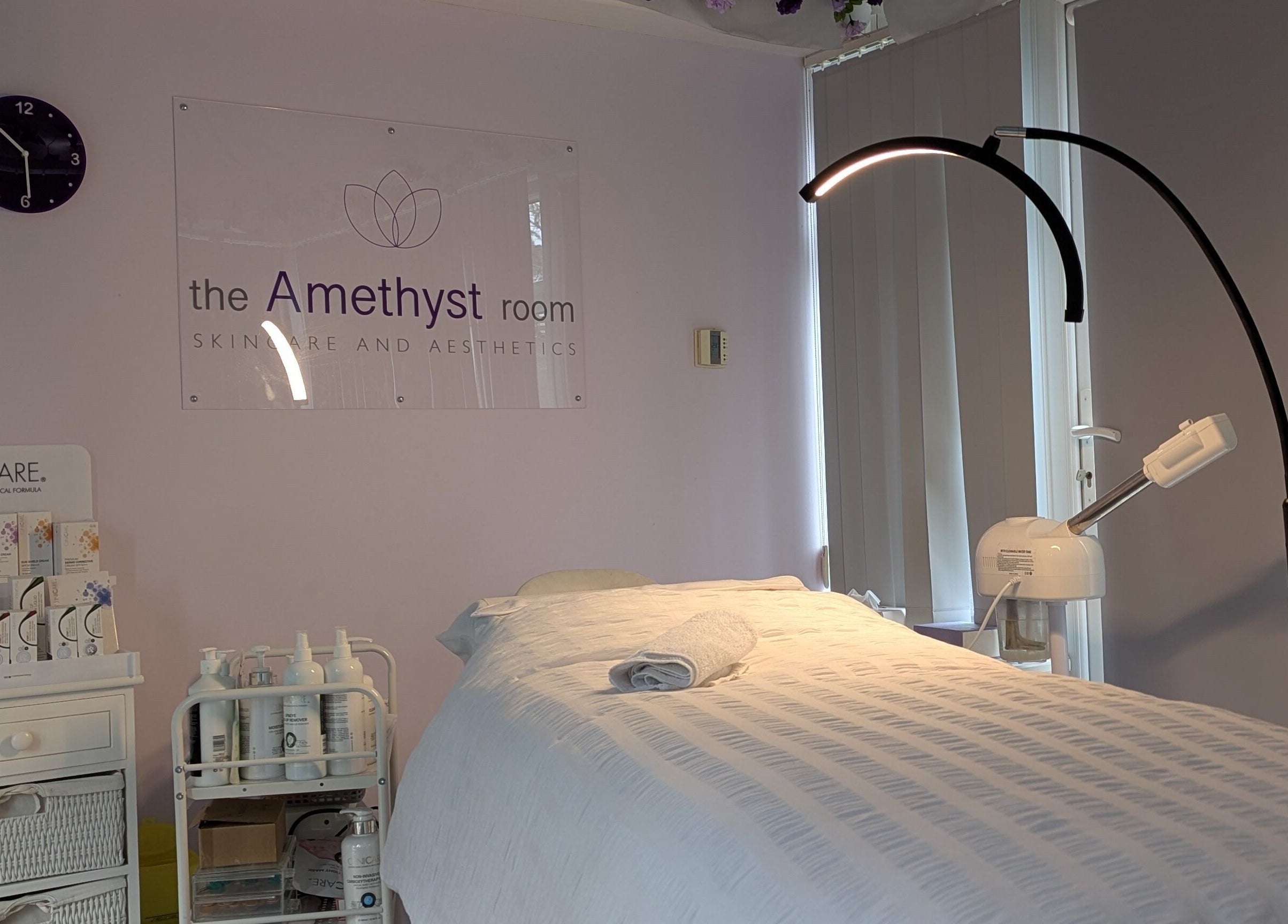 Relaxing treatment room at The Amethyst Room Rayleigh, featuring a cozy bed and aesthetic equipment in Rayleigh, England, GB.
