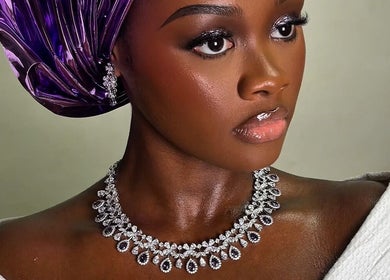 Elegant woman in stylish headwrap and jewelry at Belleyenn Artistry, Lagos, Lagos, NG.