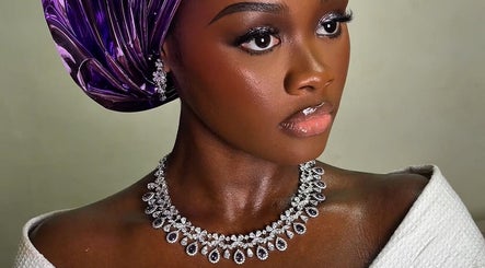 Elegant woman in stylish headwrap and jewelry at Belleyenn Artistry, Lagos, Lagos, NG.
