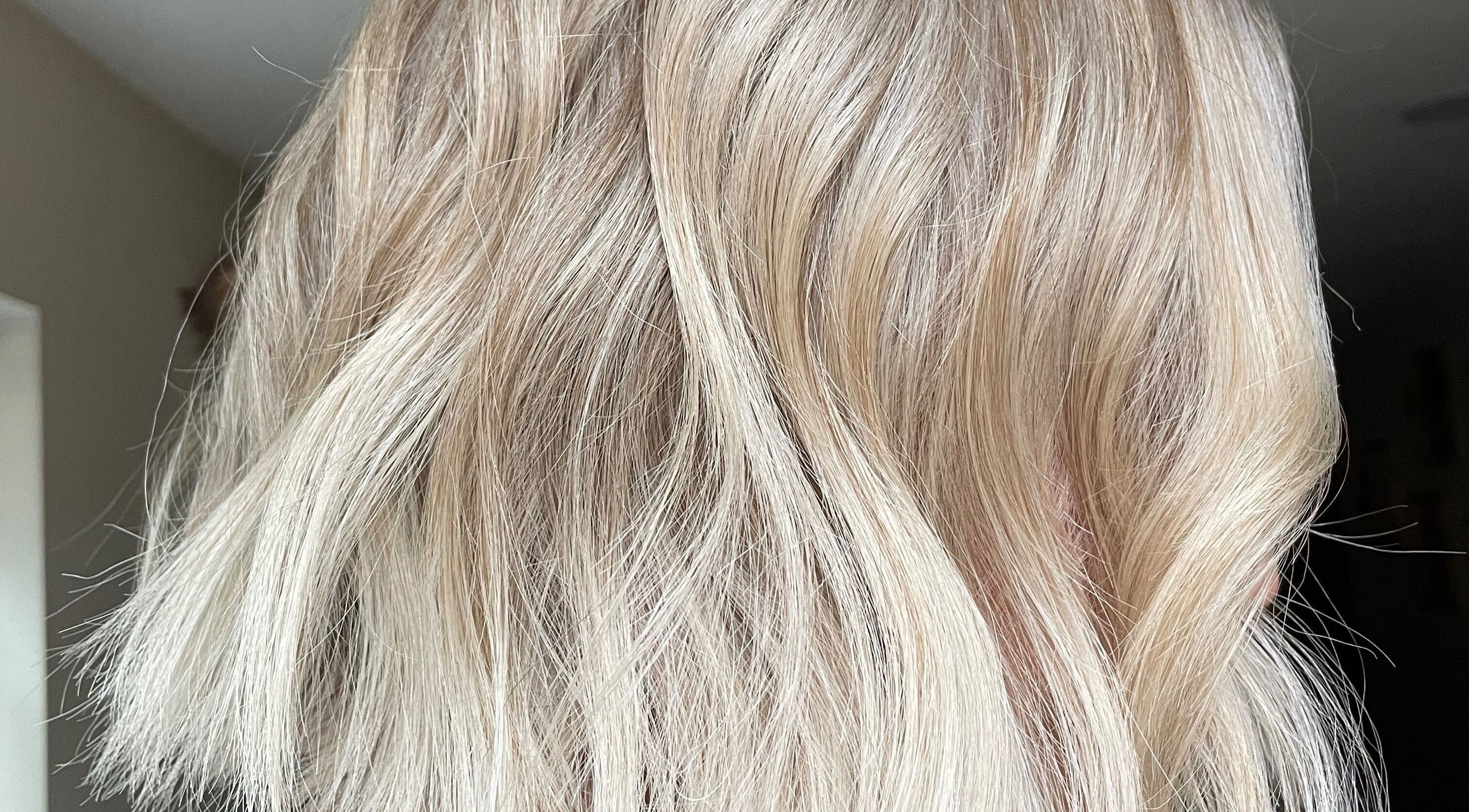 Elegant blonde hair styled beautifully at Ffi Hair in Pontyclun, Wales, GB showcasing silky, wavy tresses.