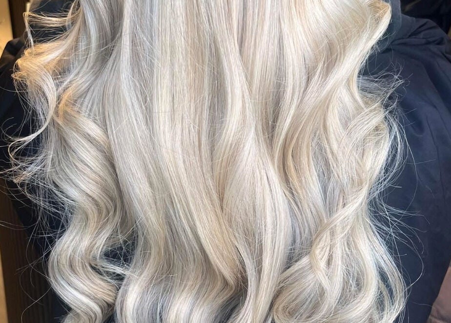 Silky blonde waves showcased at The Secret Salon, Dinnington, England, GB, ideal for premium hair styling.