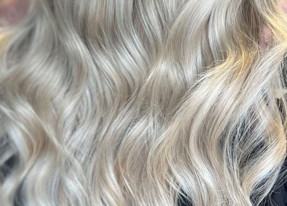 Blonde wavy hairstyle at The Secret Salon in Dinnington, England, GB showcasing expert hair styling.