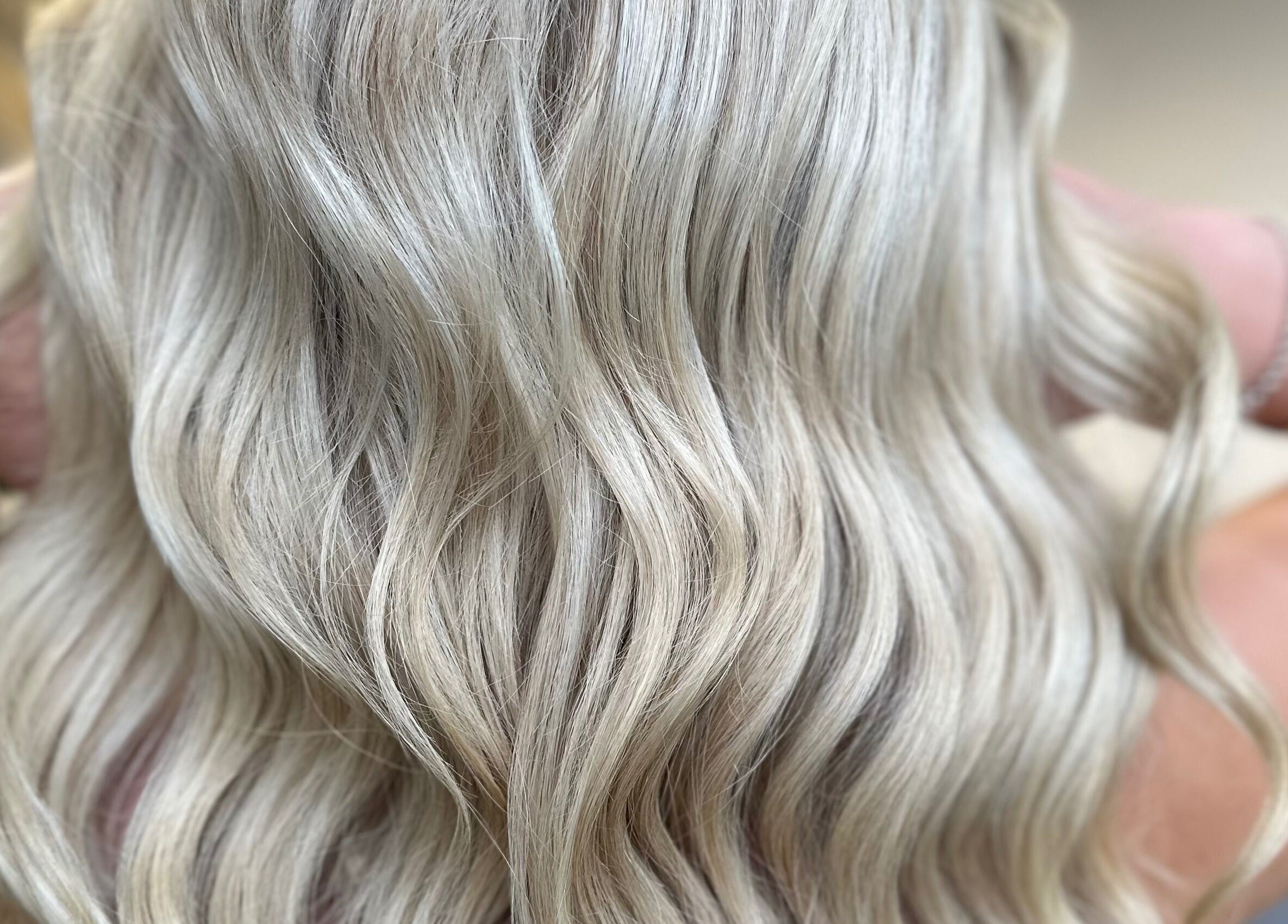 Silky blonde hair waves styled at The Secret Salon, Dinnington, England, GB.