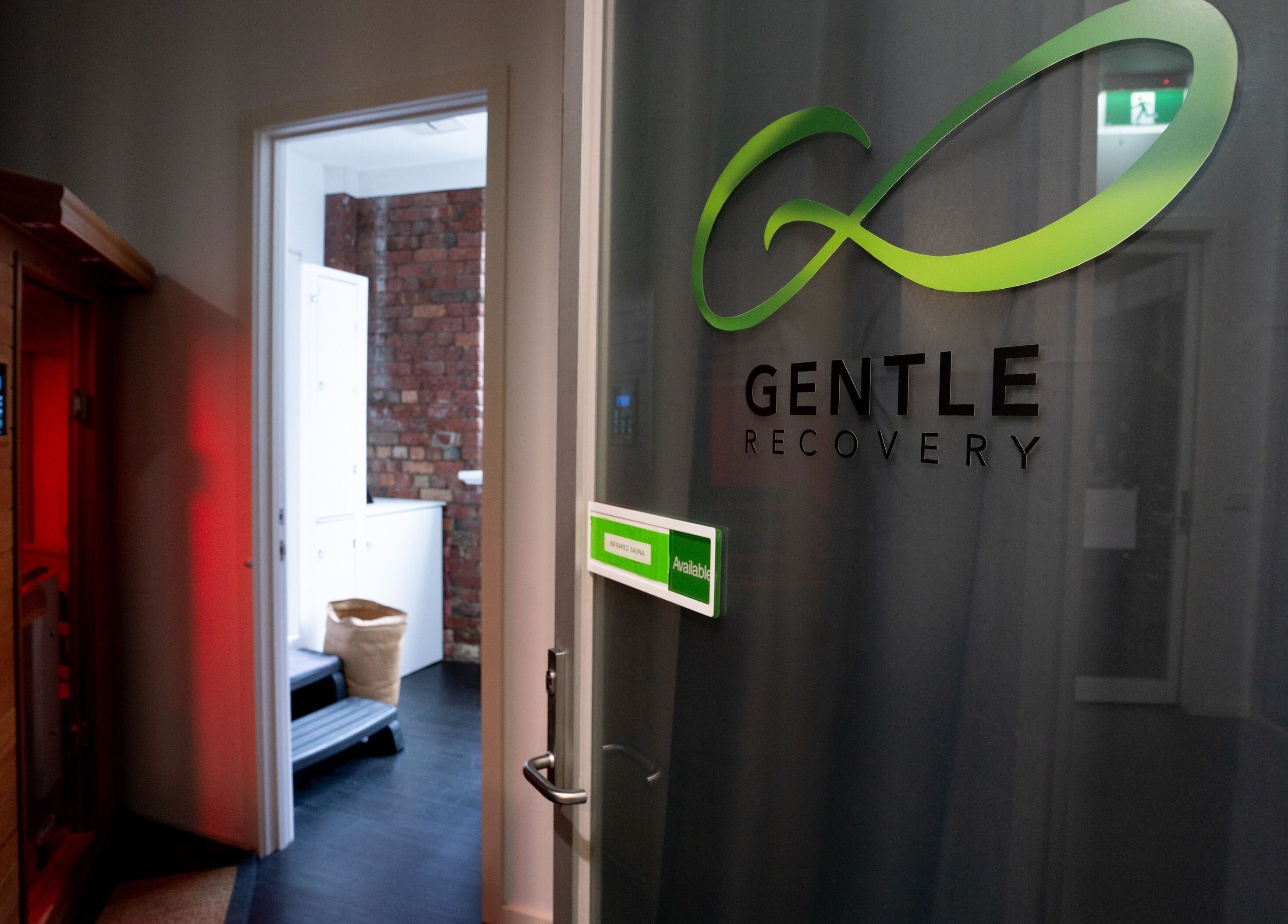 Entrance to Gentle Recovery sauna in South Melbourne, VIC, AU, with inviting warm tones and modern design.