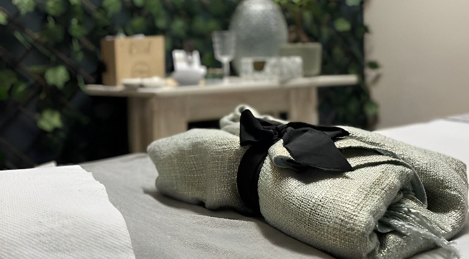 Relaxing spa setting at AfriU Refinery, George, Western Cape, ZA with lush greenery and delicate accents.