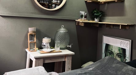 Relaxing treatment area at AfriU Refinery, George, Western Cape, ZA with elegant decor and soothing ambiance.
