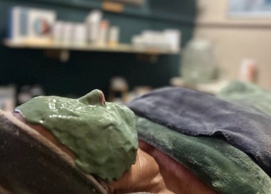 Relaxing facial treatment with green mask at AfriU Refinery, George, Western Cape, ZA.