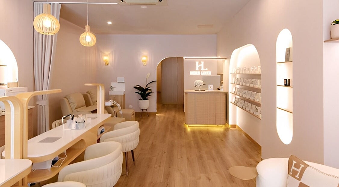 Elegant interior of Hers Luxe - Camberwell, Melbourne, Victoria, AU featuring cozy seating and modern lighting.