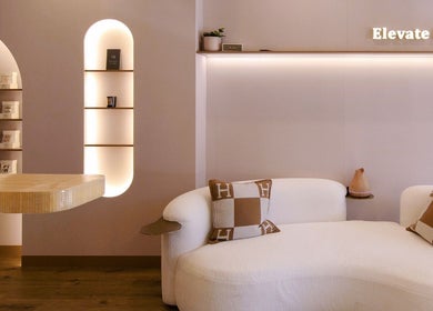 Chic interior at Hers Luxe - Camberwell, Melbourne, Victoria, AU with a plush sofa and warm lighting.