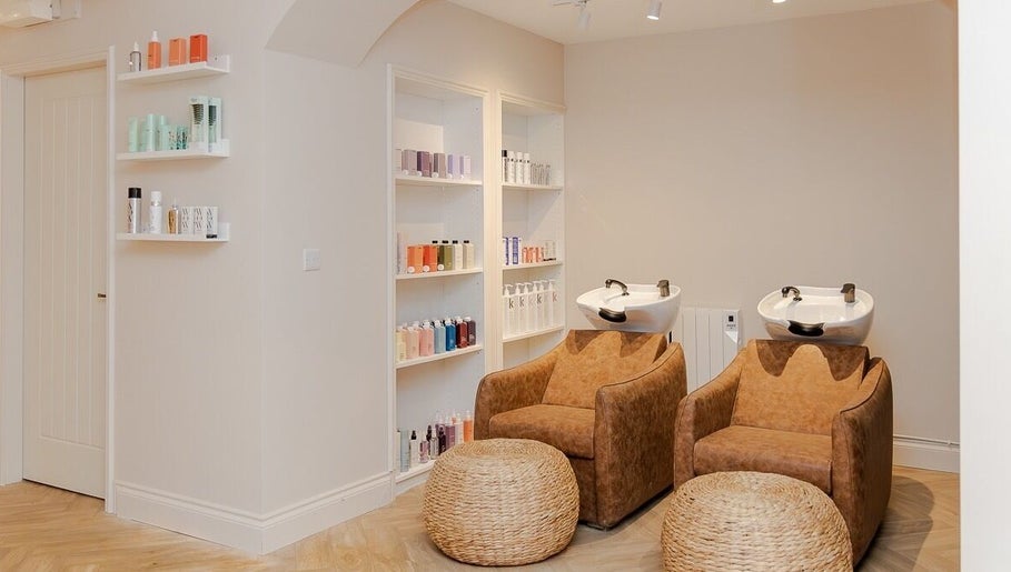 Luxurious wash station at The Suite by Jennifer O’Kane, Limerick, IE, featuring premium hair care products.