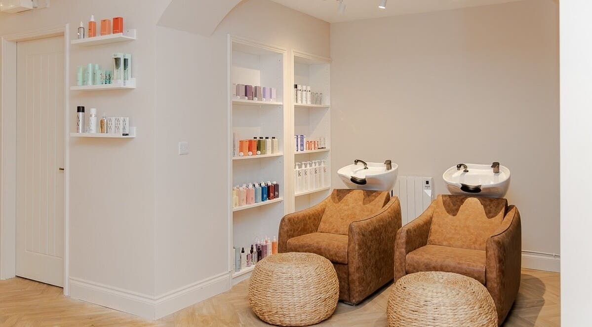 Luxurious wash station at The Suite by Jennifer O’Kane, Limerick, IE, featuring premium hair care products.