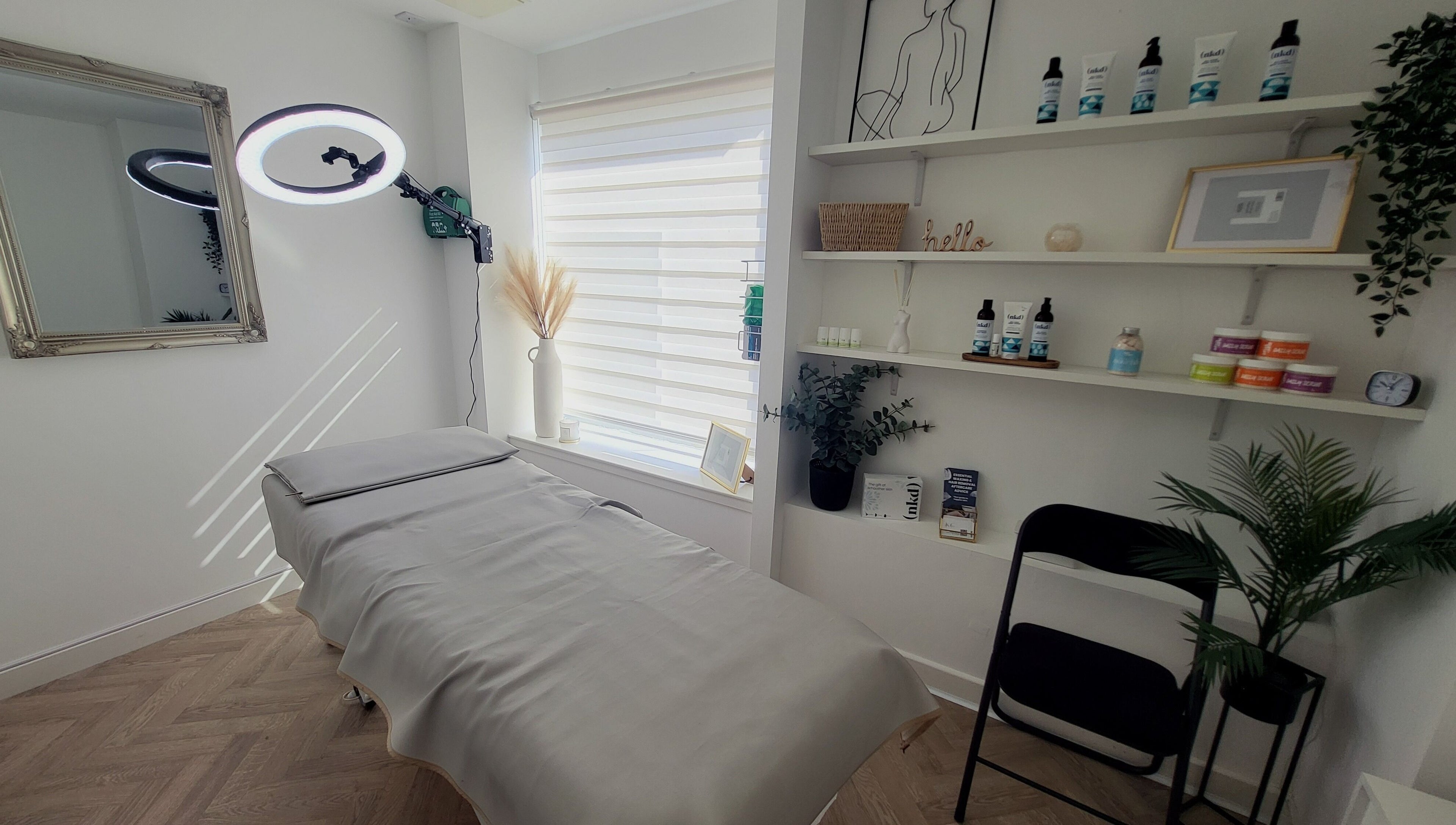 Calming interior of Bonnie & Bare Waxing in Dunfermline, Scotland, GB with treatment bed and soothing decor.