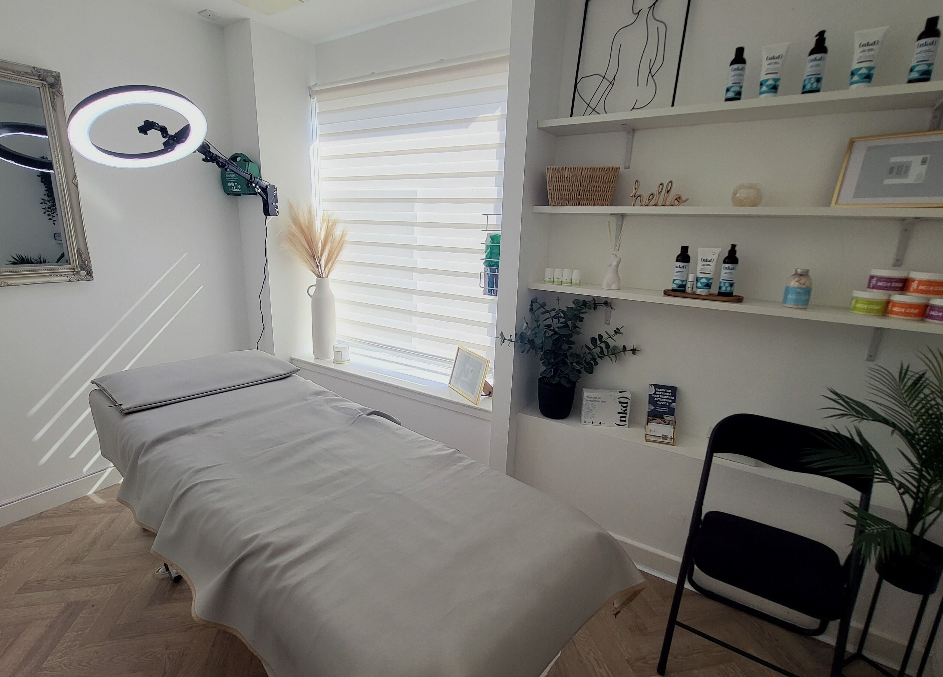 Calming interior of Bonnie & Bare Waxing in Dunfermline, Scotland, GB with treatment bed and soothing decor.