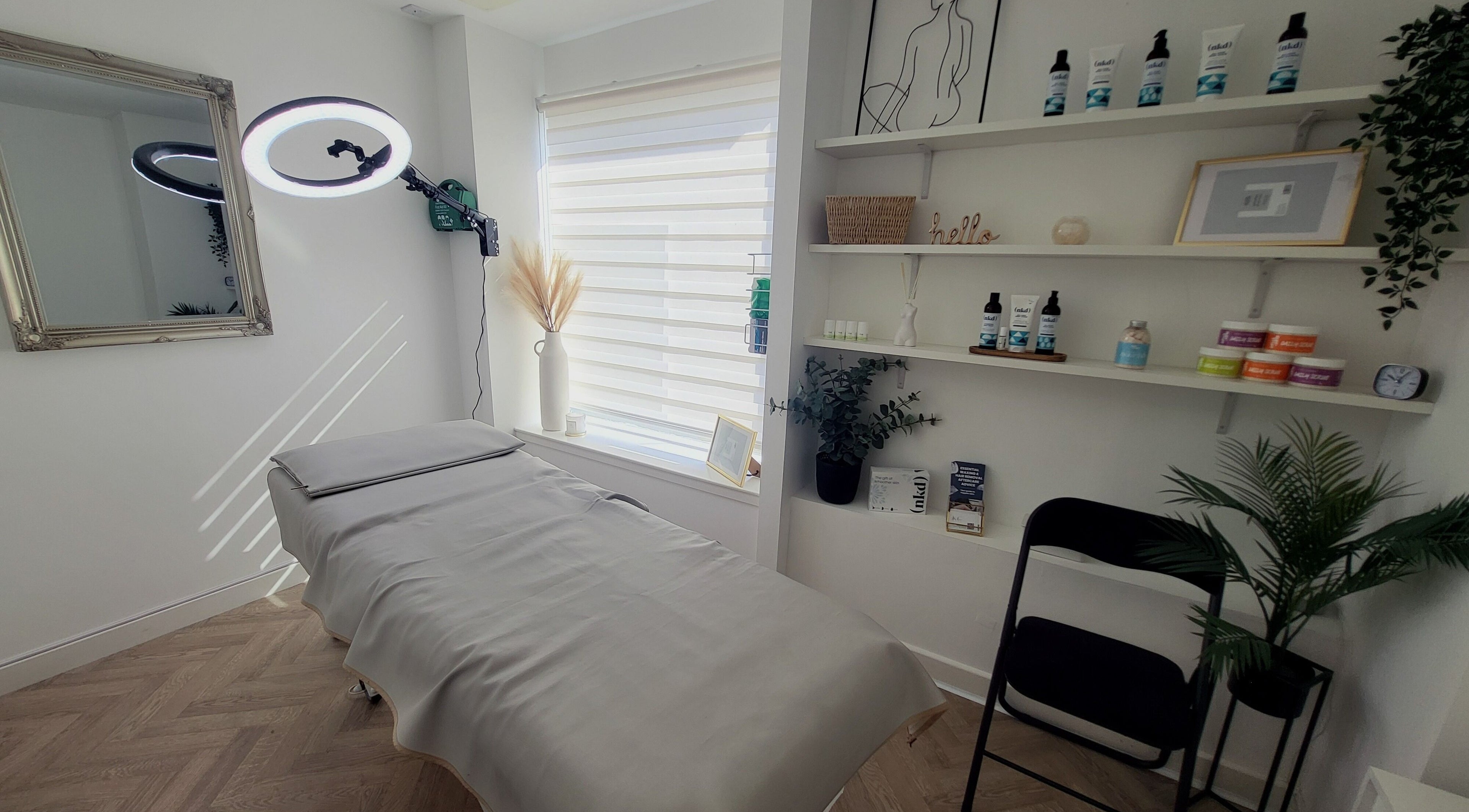 Calming interior of Bonnie & Bare Waxing in Dunfermline, Scotland, GB with treatment bed and soothing decor.