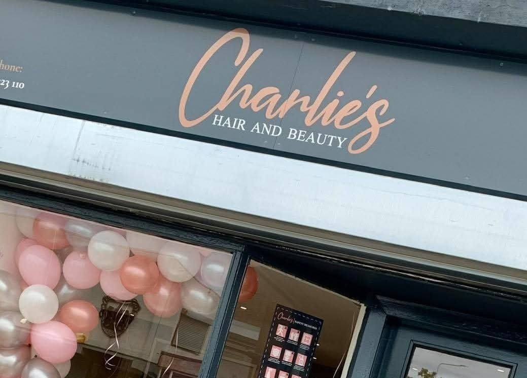 Exterior of Bonnie & Bare Waxing at Dunfermline, Scotland, GB showcasing elegant shop sign and window display.