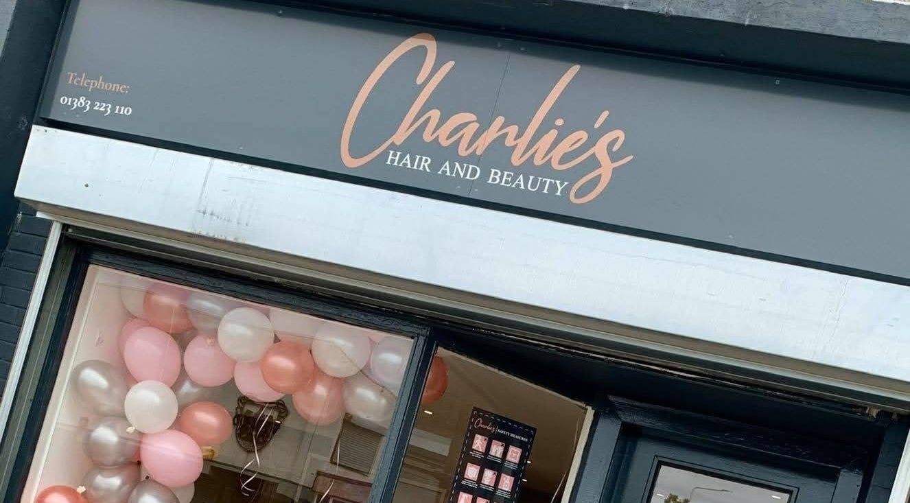 Exterior of Bonnie & Bare Waxing at Dunfermline, Scotland, GB showcasing elegant shop sign and window display.