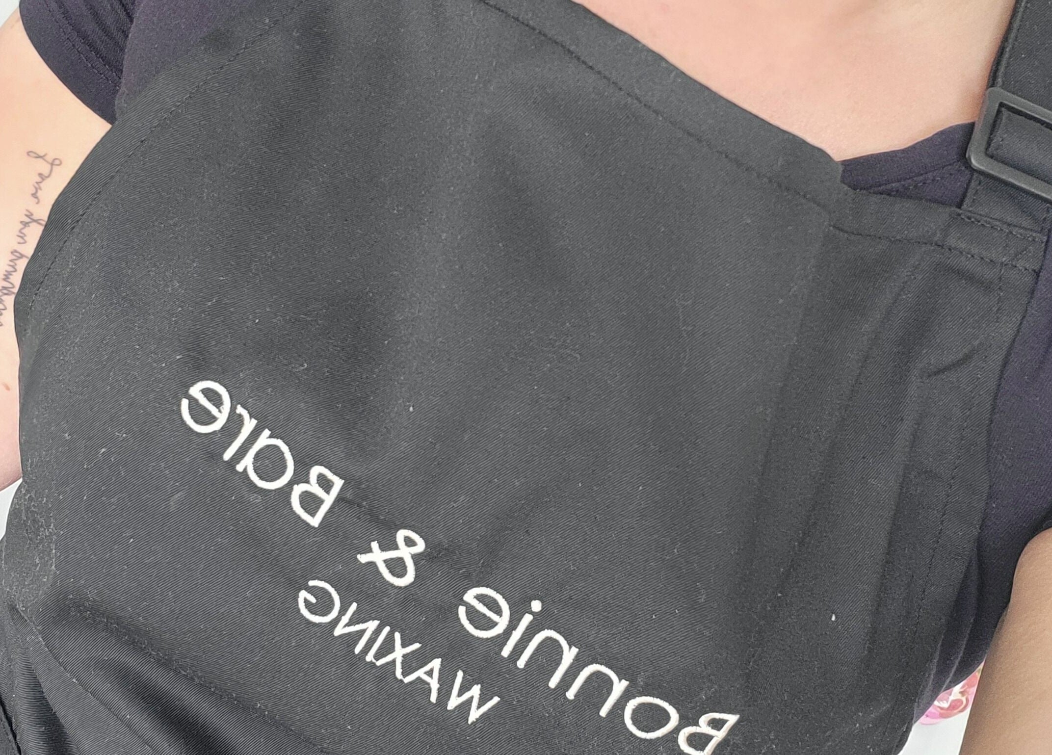 Staff apron with Bonnie & Bare Waxing logo, Dunfermline, Scotland, GB.