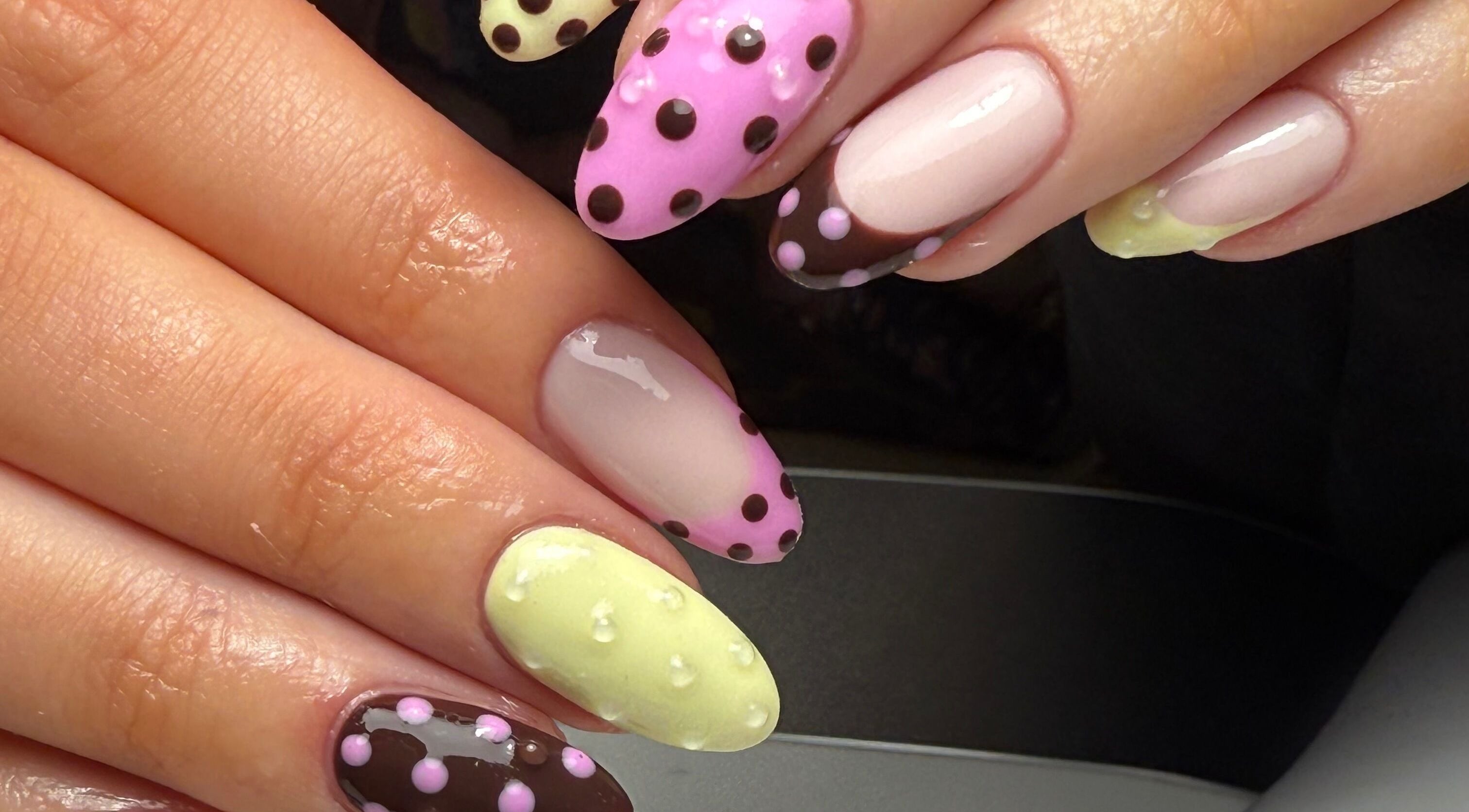 Colorful polka dot nail art at Evie Grace Beauty, Brierfield, England, GB.