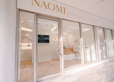 Front view of Naomi Laser and Skin Clinic in Mascot, New South Wales, AU showcasing modern glass exterior.