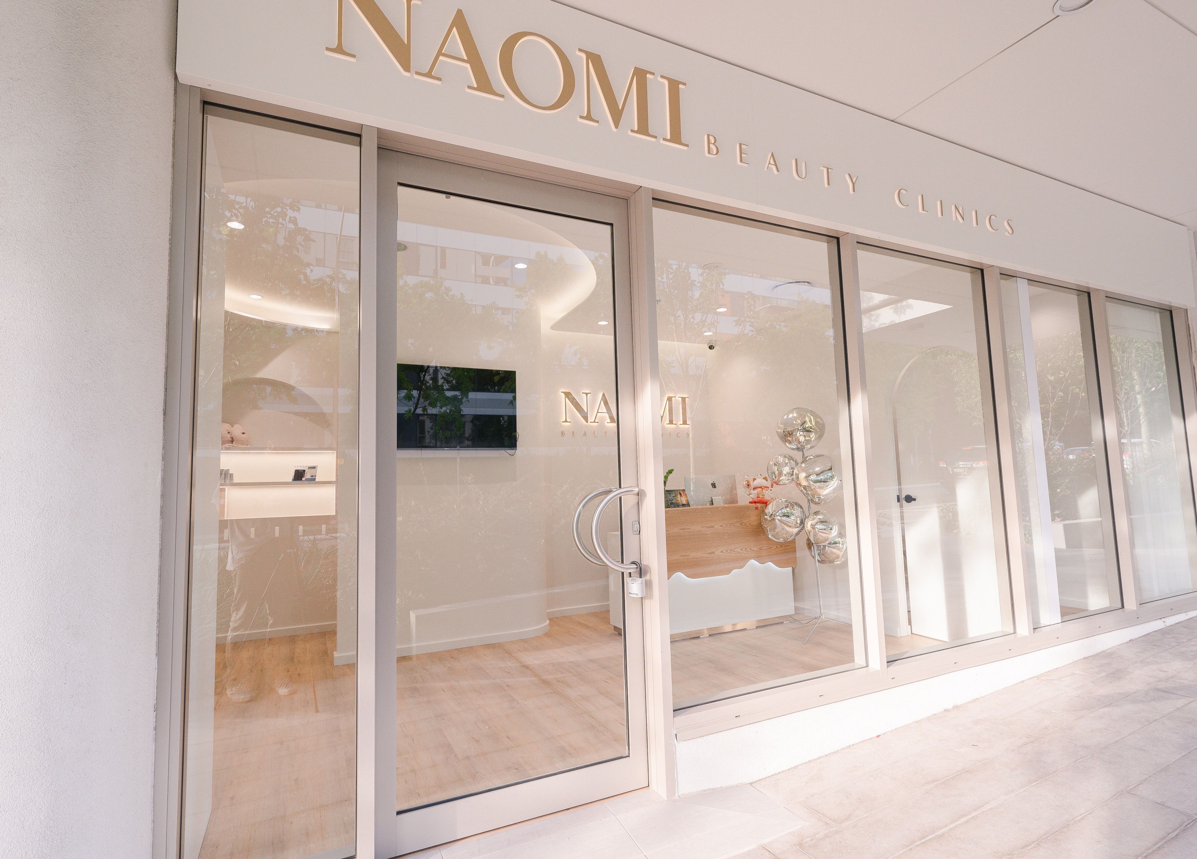 Entrance of La Mascotte Skin and Laser Clinic in Mascot, New South Wales, AU with elegant glass doors.