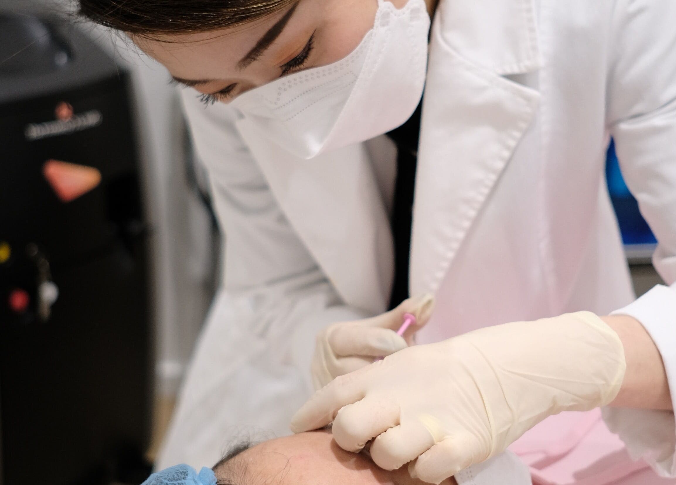 Expert performing patient treatment at La Mascotte Skin and Laser Clinic, Mascot, New South Wales, AU.