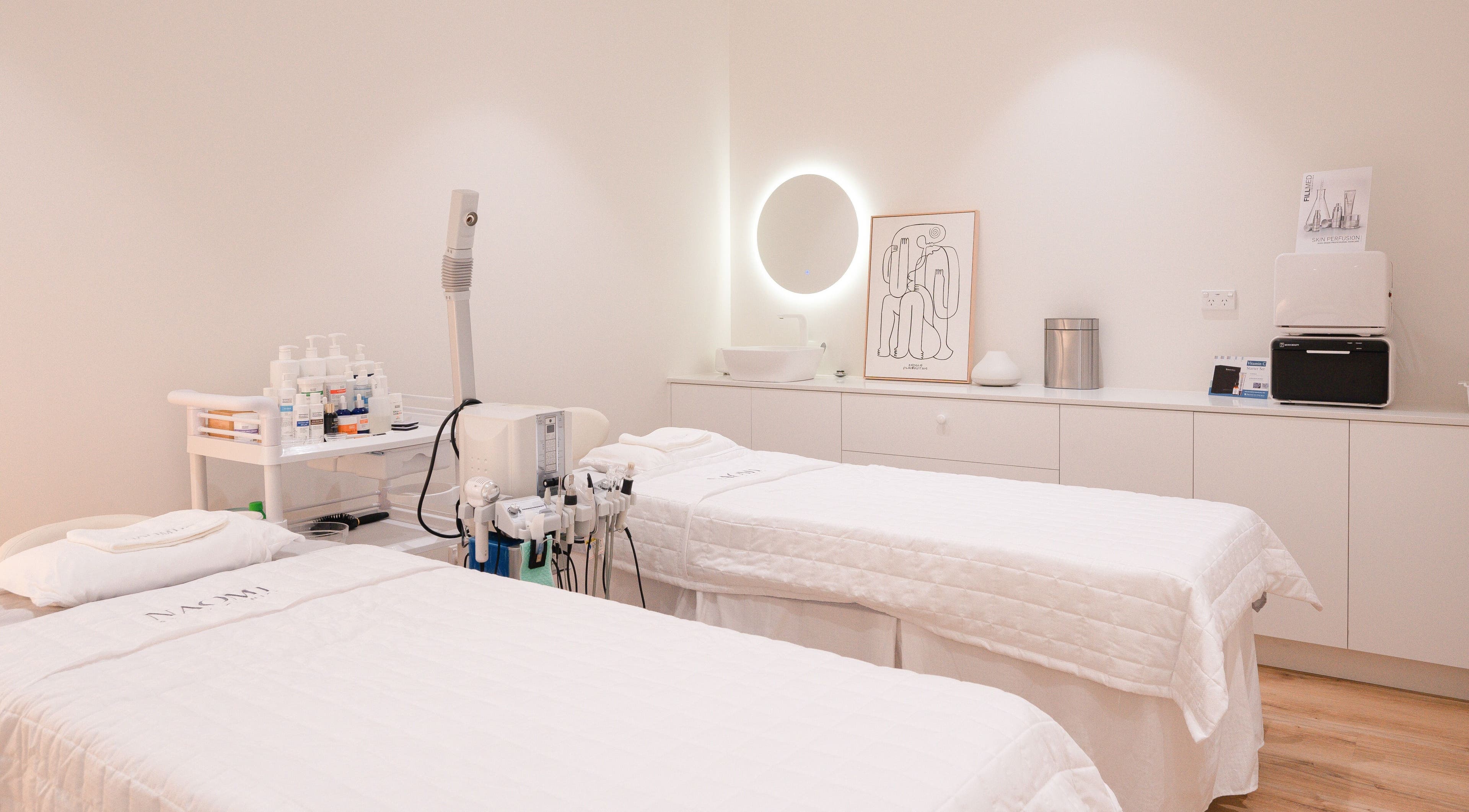 Calm treatment room at La Mascotte Skin and Laser Clinic in Mascot, New South Wales, AU with twin beds and equipment.