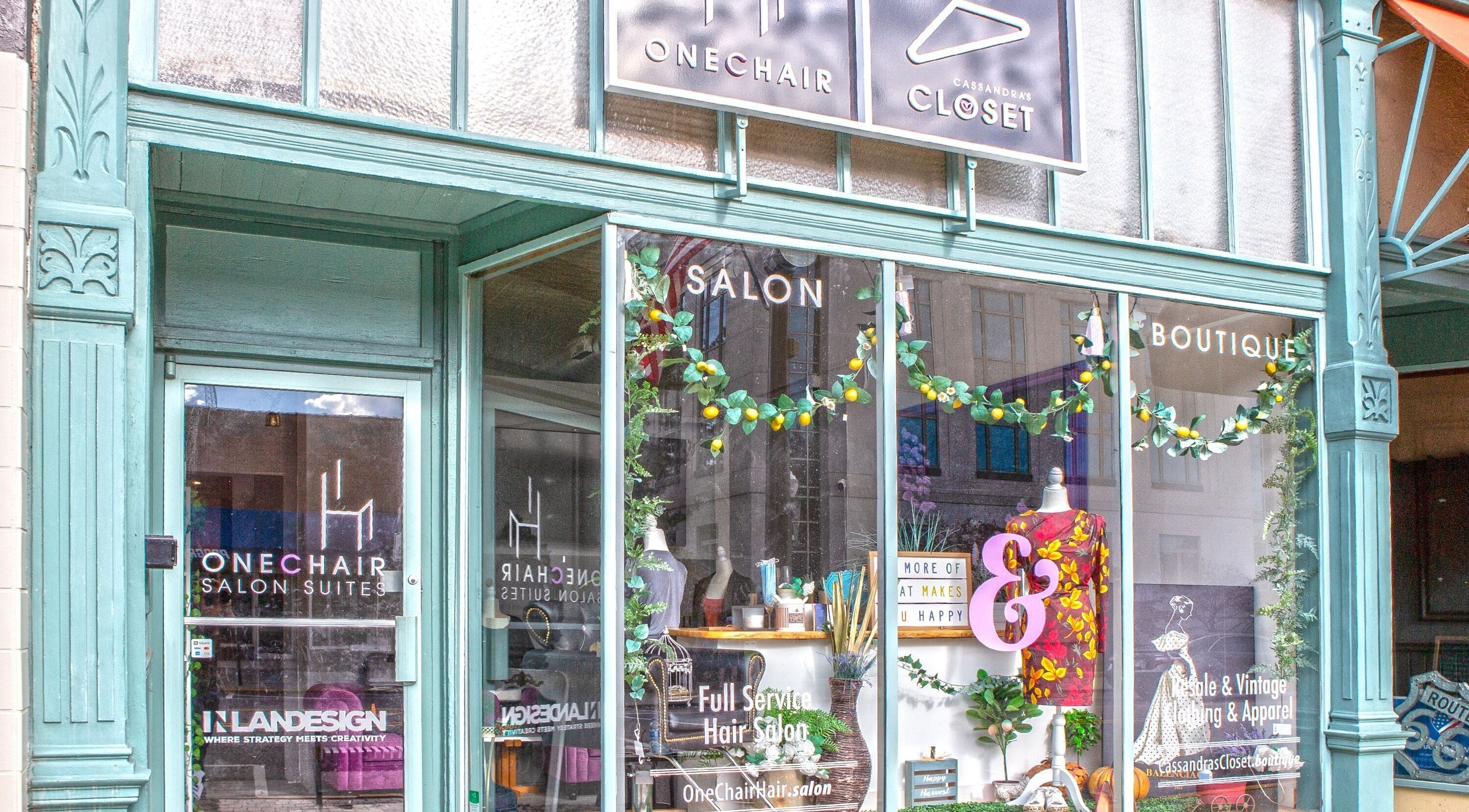 Front of One Chair Hair by Cassandra, a vibrant salon in Edwardsville, Illinois, US with stylish window displays.