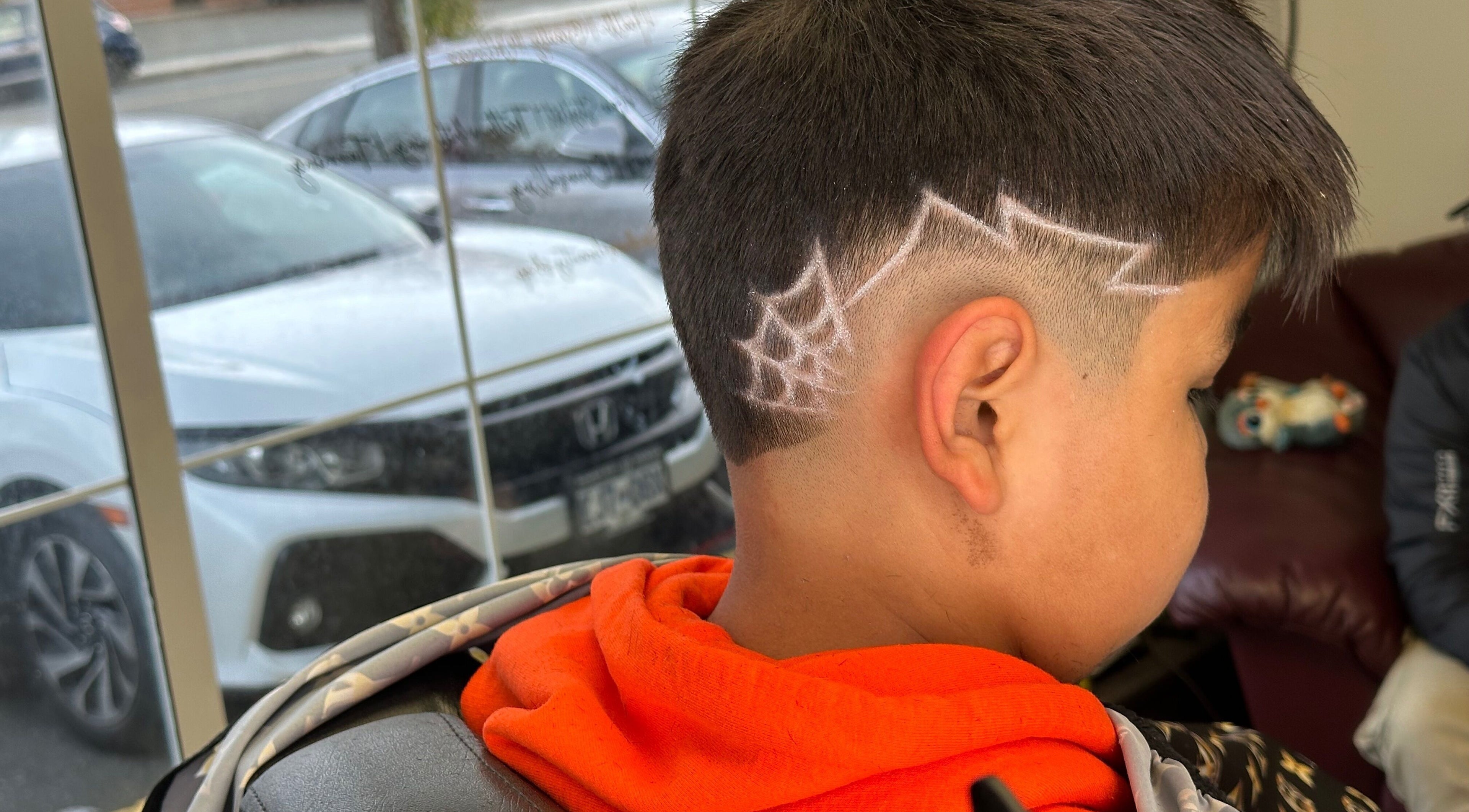 Creative spider web haircut design at Sam the Barber, Campbell River, British Columbia, CA.