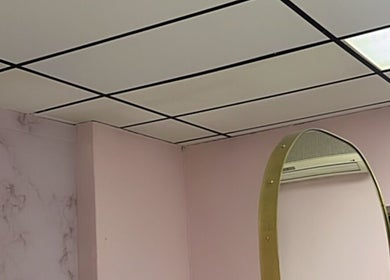 Modern interior at Melanin Lash Bar SA, Sandton, Gauteng, ZA, featuring stylish ceiling design.