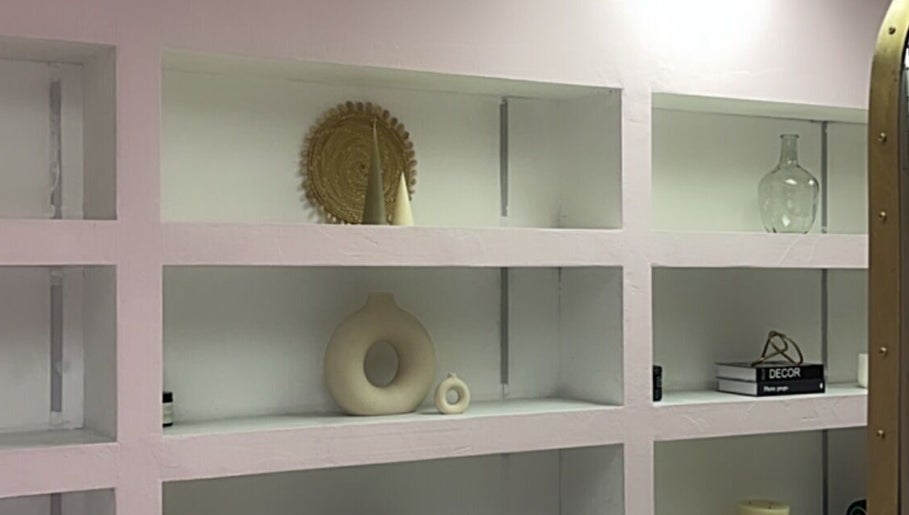 Elegant shelving with decor at Melanin Lash Bar SA, Sandton, Gauteng, ZA.