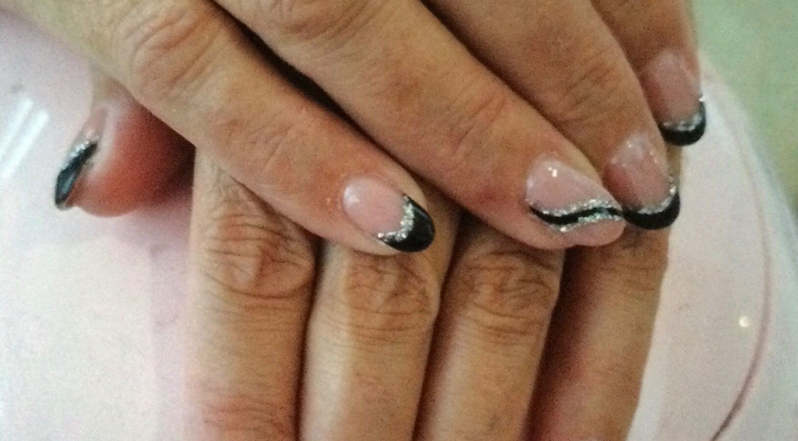 Stylish black and silver manicure at Beauty and aesthetics by Carlie, Westmoors, England, GB.