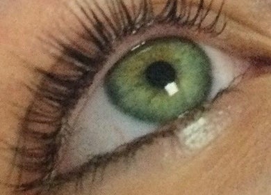 Close-up of a vibrant green eye with lash extensions at Beauty and Aesthetics by Carlie, Westmoors, England, GB.