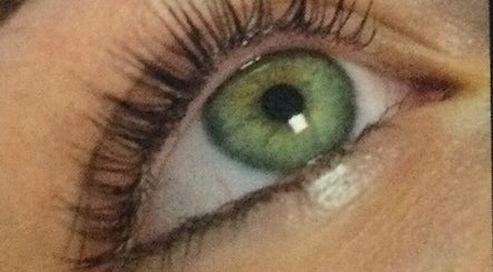 Close-up of a vibrant green eye with lash extensions at Beauty and Aesthetics by Carlie, Westmoors, England, GB.