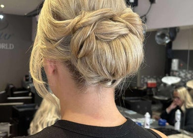Blonde hair in a braided updo at MKM.hair, Perth, Scotland, GB salon, showcasing expert styling.