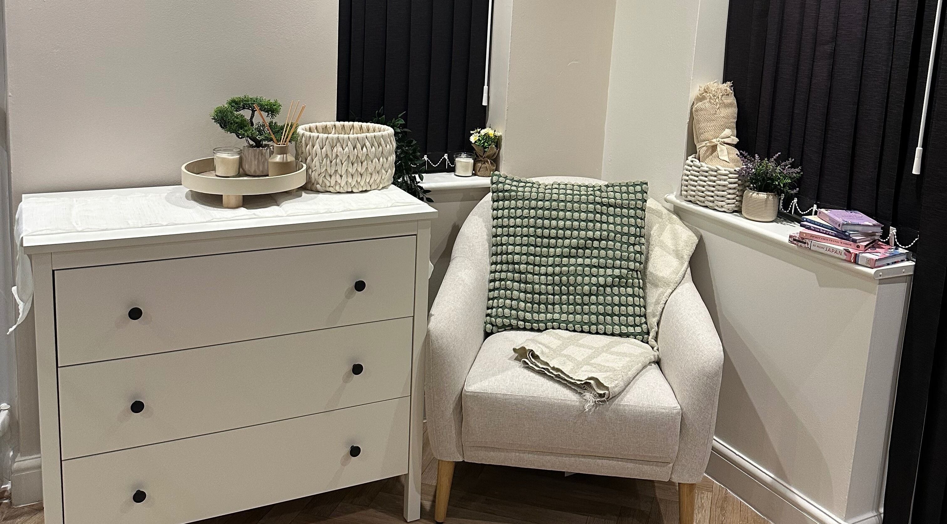 Elegant white dresser and cozy chair at Venus Studios, Kirkby In Ashfield, England, GB.