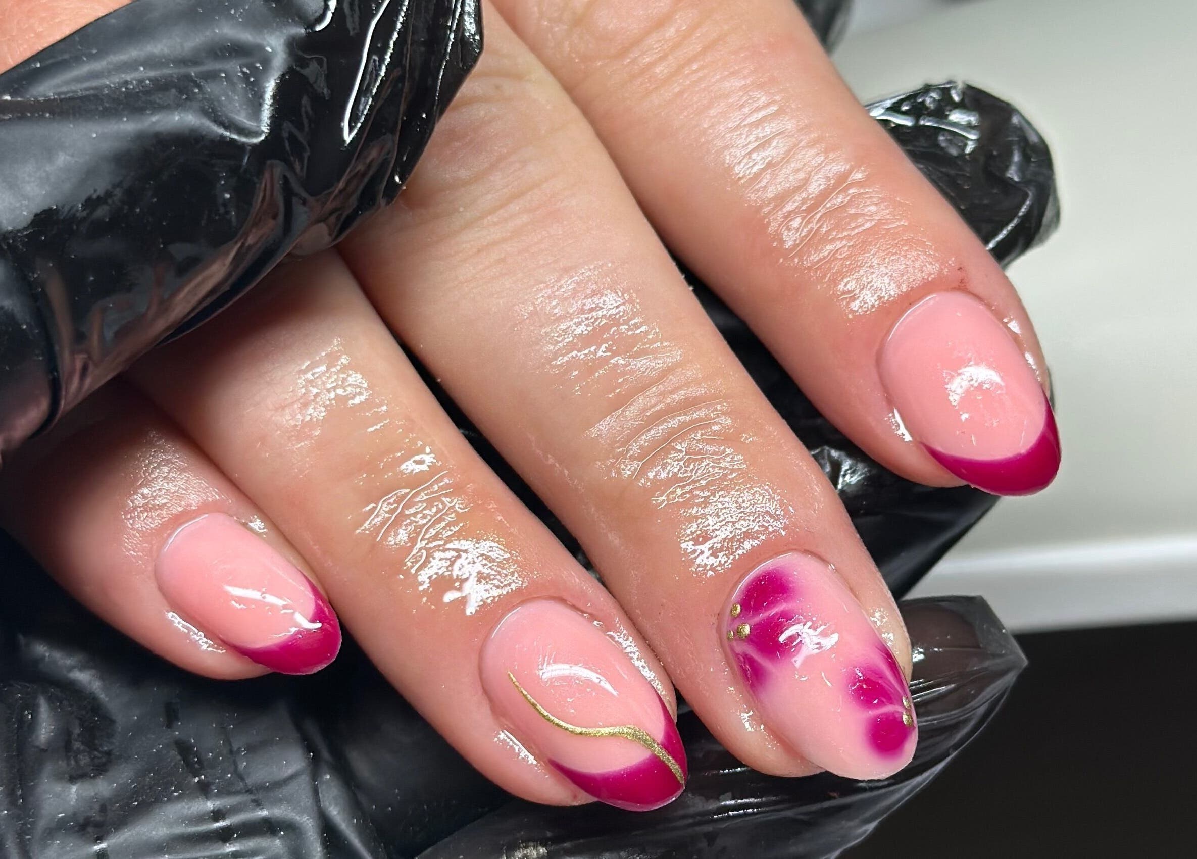 Stylish pink nail art at Venus Studios, Kirkby In Ashfield, England, GB, featuring unique designs.